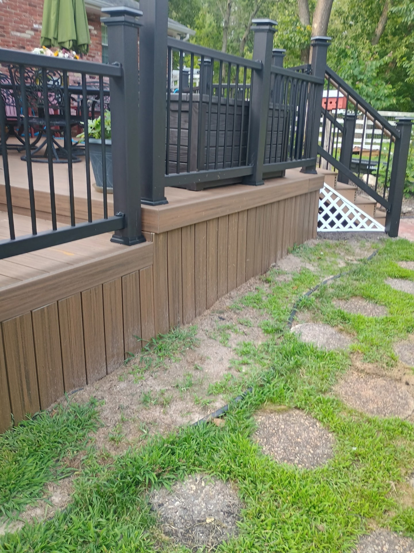 Composite deck gate leading to garden path
