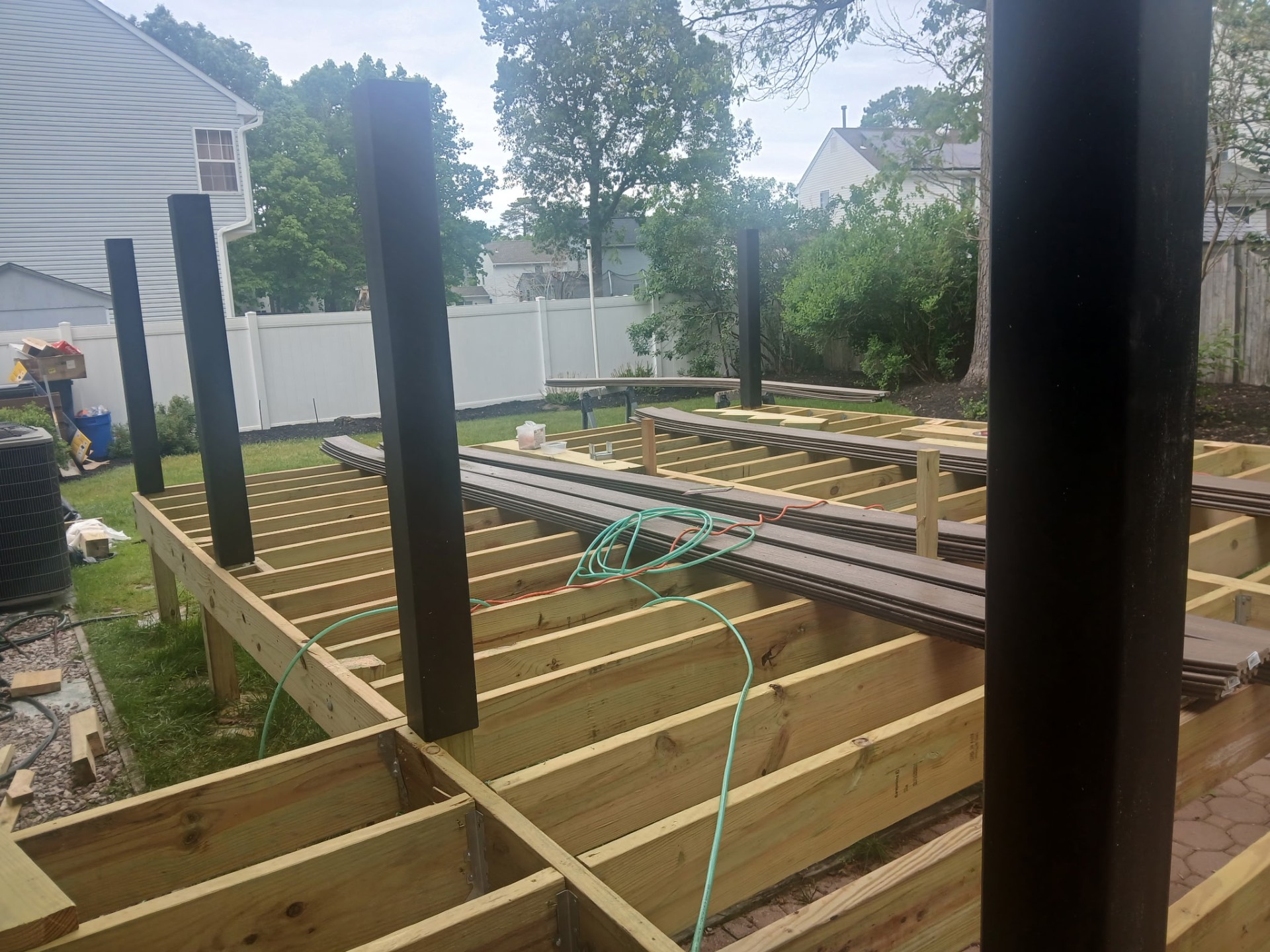 New composite deck framing with black posts