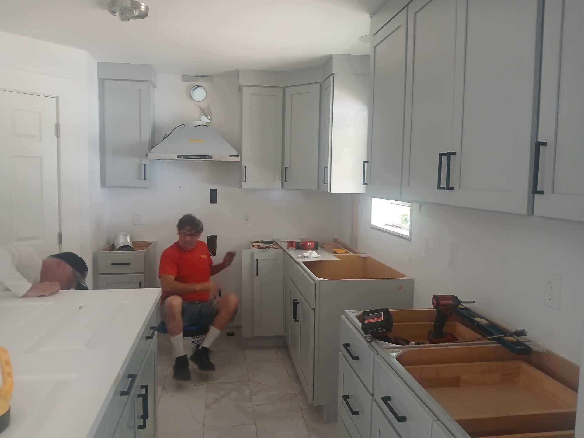 Kitchen remodel — new cabinets, hood, and countertops installed