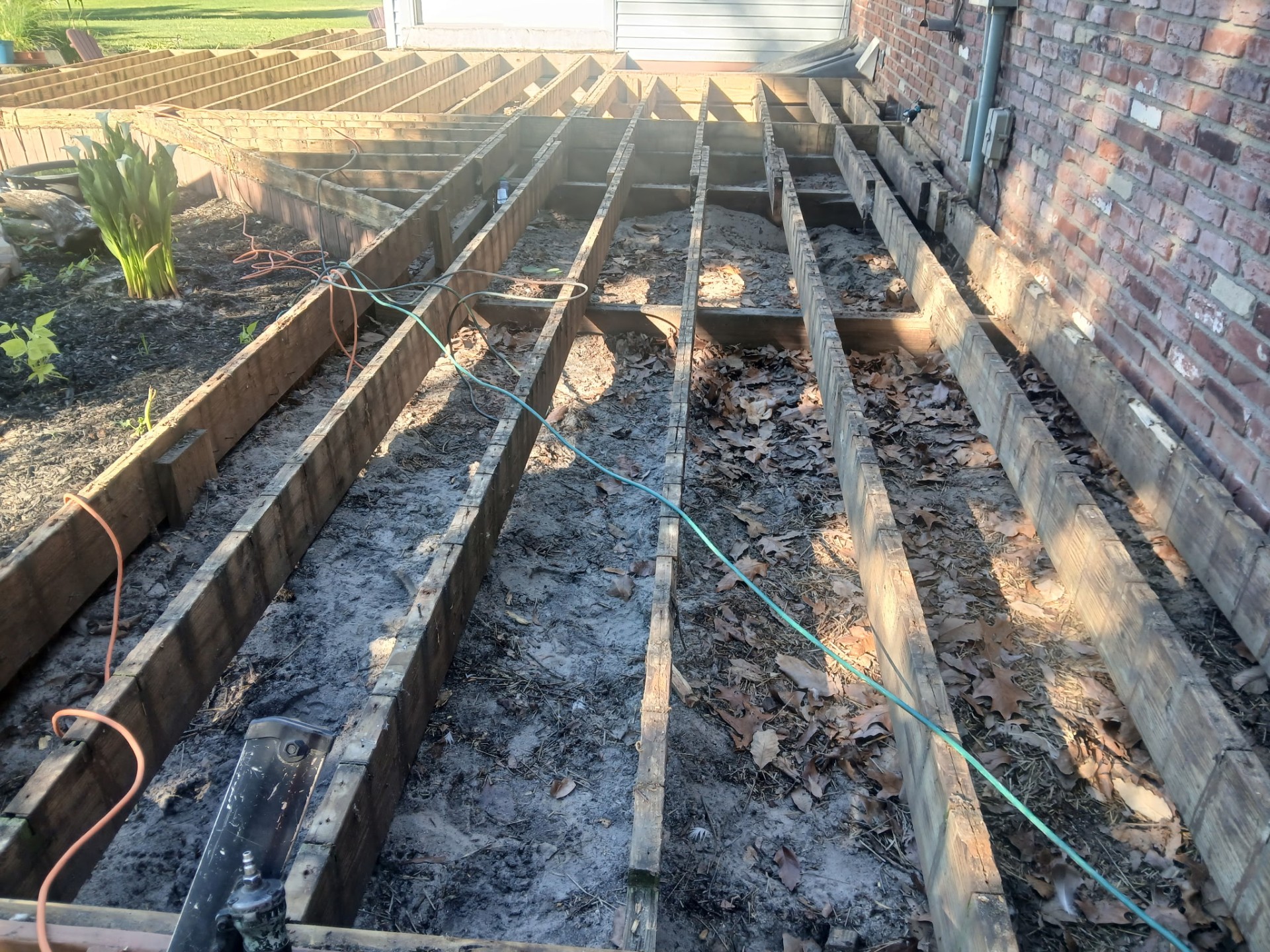 Rebuilt deck joists on a full deck tear-off